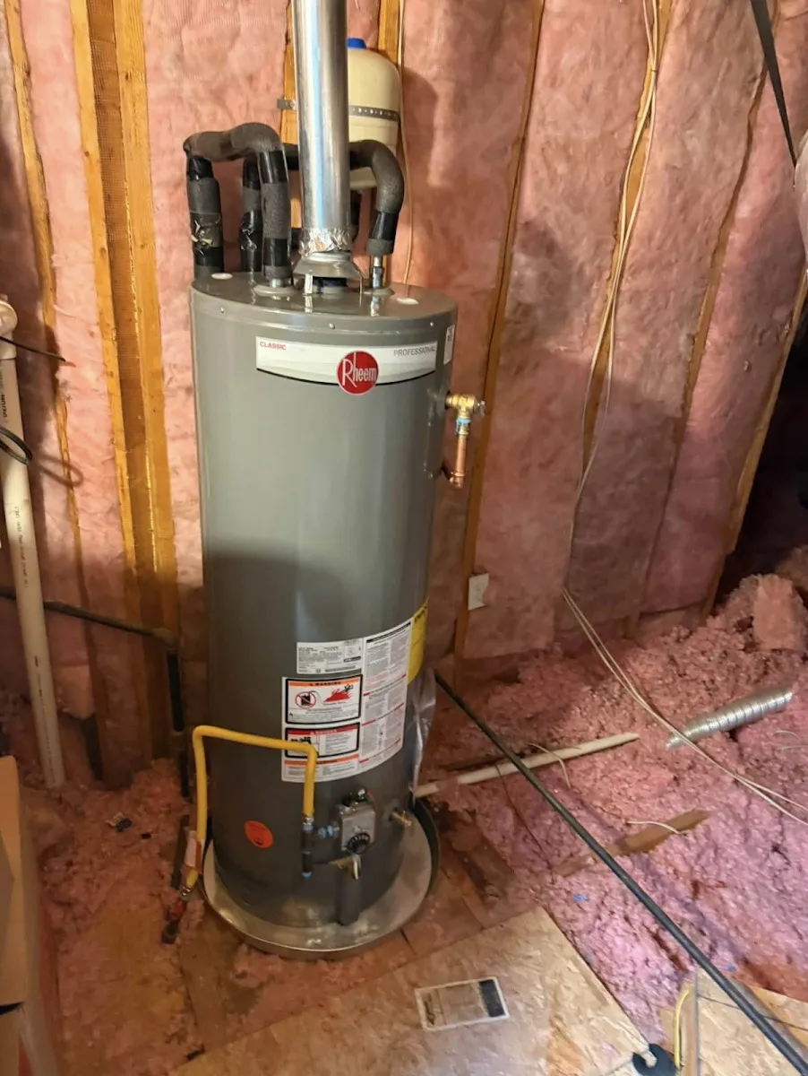 A newly installed tank water heater with new supply piping